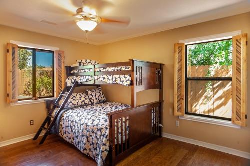 a bedroom with a bunk bed and two windows at MySedonaGold, The Place to Chill in Sedona in Sedona