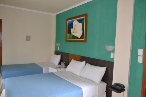 Postel nebo postele na pokoji v ubytování Hotel Poloni