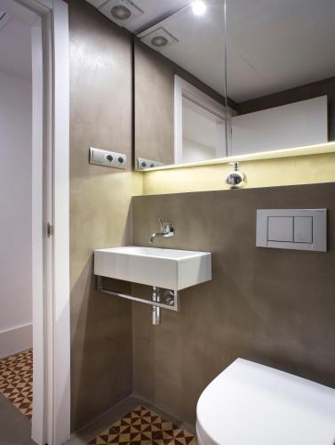 a bathroom with a sink and a toilet at Best House Best Place in Barcelona