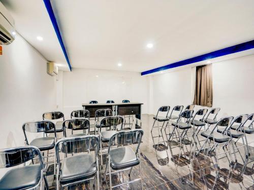 a room with a bunch of chairs in it at LG Hotel Jember in Berpodak