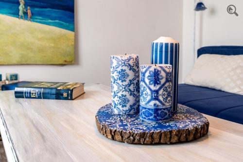 two blue and white vases sitting on top of a table at Wine house apartment in Karaburma