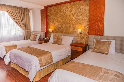 Postel nebo postele na pokoji v ubytování Hotel Chimborazo Internacional