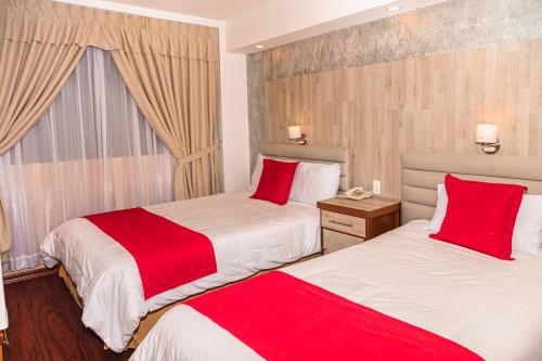 Ein Bett oder Betten in einem Zimmer der Unterkunft Hotel Chimborazo Internacional