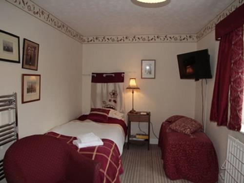 A bed or beds in a room at Amber House 
