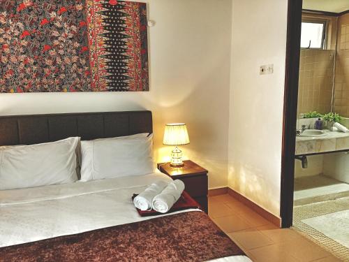 Fotografie z fotogalerie ubytování FAMISA Eastern Gold Service Apartment v Kertehu