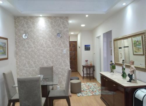 a living room with a desk and a mirror at Copacabana Beach Modern Apartments in Rio de Janeiro