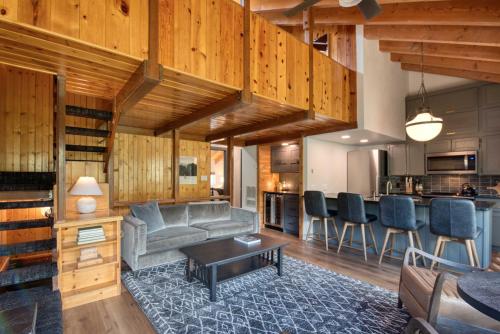 a living room with a couch and a table at Ski Condo in Chalet Village at Brian Head! in Brian Head