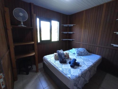 Tempat tidur dalam kamar di Pousada Biso Finoca Ibiraquera