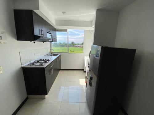 Η κουζίνα ή μικρή κουζίνα στο Apartamento privado a 2kms del parque del café