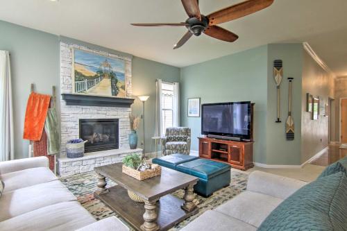 a living room with a couch and a tv at 5 Mi to Bethany Beach Chic Home with Grill! in Ocean View