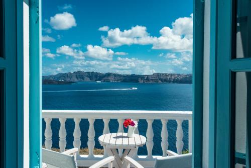 a view of the ocean from a balcony at Villa Maria Apartments in Akrotiri
