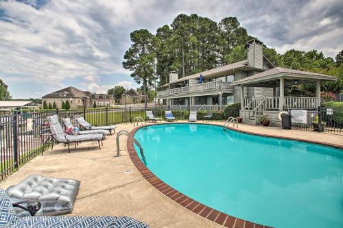a swimming pool in front of a house at Balcony and Lake Access Hot Springs Getaway! in Hot Springs