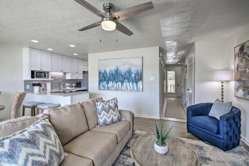 a living room with a couch and a table at Balcony and Lake Access Hot Springs Getaway! in Hot Springs