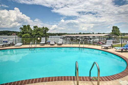 a large swimming pool with chairs and tables at Balcony and Lake Access Hot Springs Getaway! in Hot Springs