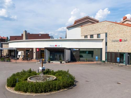 an empty parking lot in front of a building at Holiday Club Vierumäki in Vierumäki