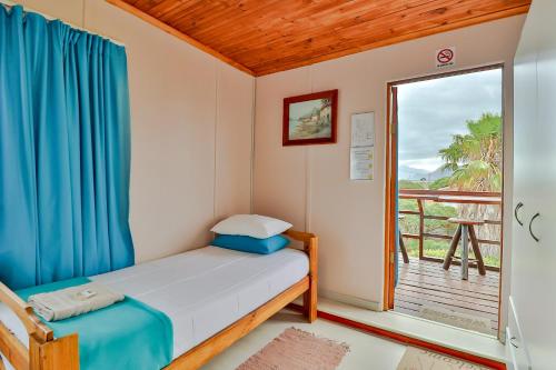 Ένα ή περισσότερα κρεβάτια σε δωμάτιο στο Fisherhaven Travellers Lodge