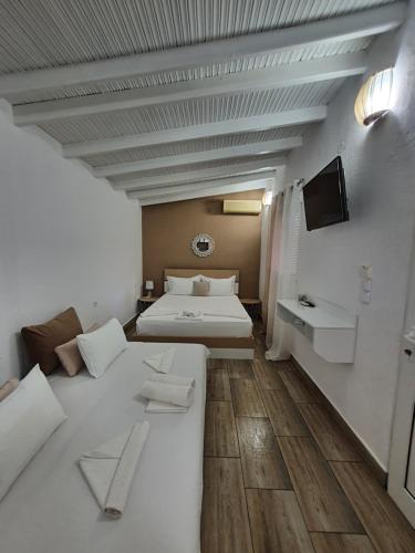 Ένα ή περισσότερα κρεβάτια σε δωμάτιο στο River rooms kriaritsi