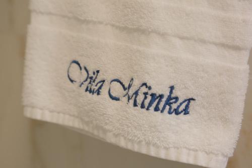 a towel with the word china written on it at ApartHotel Vila Minka in Ljubljana