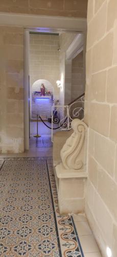 a person taking a picture in a room with a tile floor at Central 214 Boutique Hotel in Hamrun