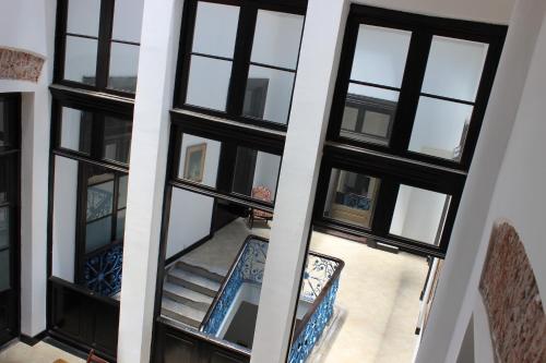 an aerial view of a building with black windows at Montevideo Chic Hostel in Montevideo