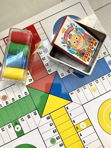 a monopoly game with a box on top of it at Alcarria , Casa del Agua in Albalate de Zorita