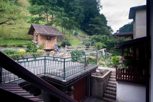 a view of a garden from a balcony of a house at Apartma Ajda in Železniki