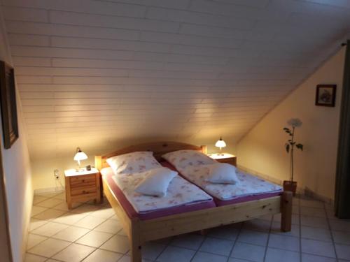 Кровать или кровати в номере Ferienwohnung Niederrhein Blick