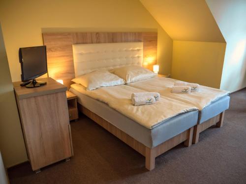 Ένα ή περισσότερα κρεβάτια σε δωμάτιο στο Stokrotka Natura Tour