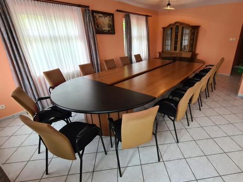 a dining room with a table and chairs at Stokrotka Natura Tour in Karpacz