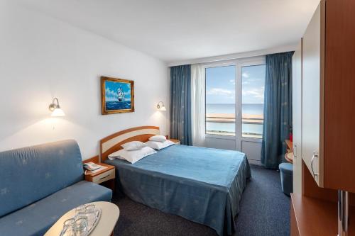 Postel nebo postele na pokoji v ubytování Hotel Sirena Saturn All Inclusive