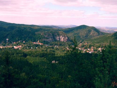 a town in the middle of a green valley at Ferienhaus Jeschkenpanorama in Luftkurort Lückendorf