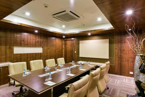 a large conference room with a long table and chairs at Souvenir Jaipur in Jaipur