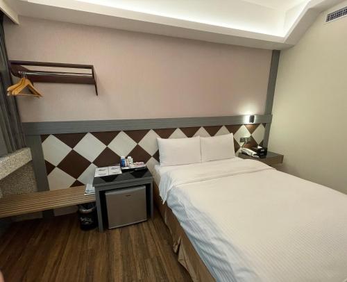 Postel nebo postele na pokoji v ubytování Weifeng Boutique Business Hotel - Zhanqian Branch