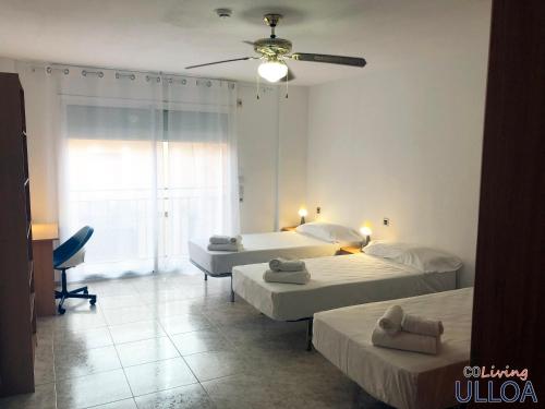 Postel nebo postele na pokoji v ubytování CoLiving Ulloa