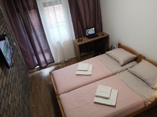 Postel nebo postele na pokoji v ubytování Apartman 25