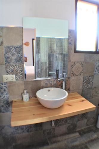 a bathroom with a sink and a mirror at VILLA COSTA LEVANTE BENIDORM in Benidorm