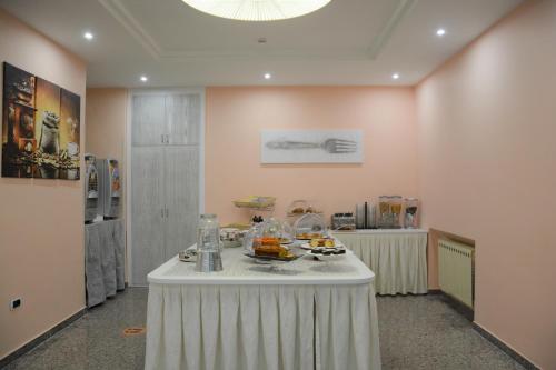a room with a table with food on it at Hotel Dei Pini in Fiuggi