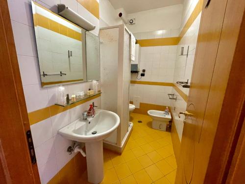 a bathroom with a sink and a toilet at Maria Carolina Casavacanze in Caserta