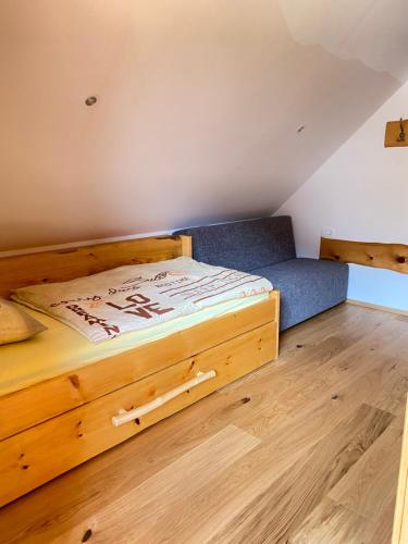 A bed or beds in a room at Apartma in Bungalov Jezerci