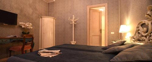 Postel nebo postele na pokoji v ubytování Locanda Casa Martini