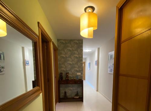 a hallway with a door and a hallway with at Altavista Apartment in Raxo
