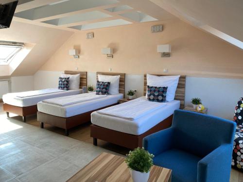 Postel nebo postele na pokoji v ubytování Hotel am Hafen
