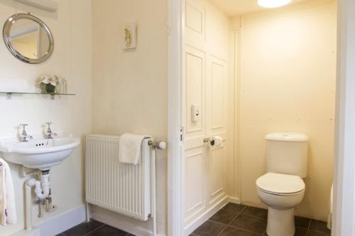 a bathroom with a toilet and a sink at Rydal Hall Christian Retreat Centre in Rydal