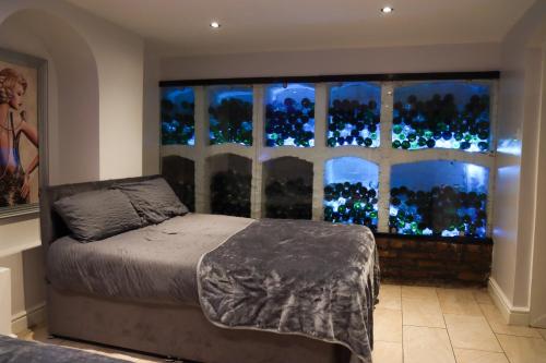 a bedroom with a bed in front of a window at 19 Rodney Street Apartments in Liverpool