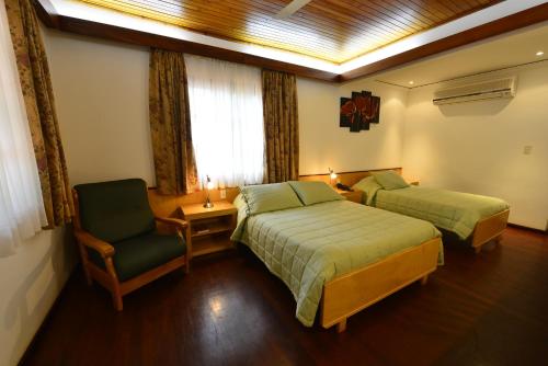 Ein Bett oder Betten in einem Zimmer der Unterkunft Hotel Restaurant Papillon