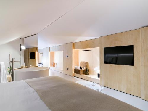 TV a/nebo společenská místnost v ubytování Criu Boutique Hotel