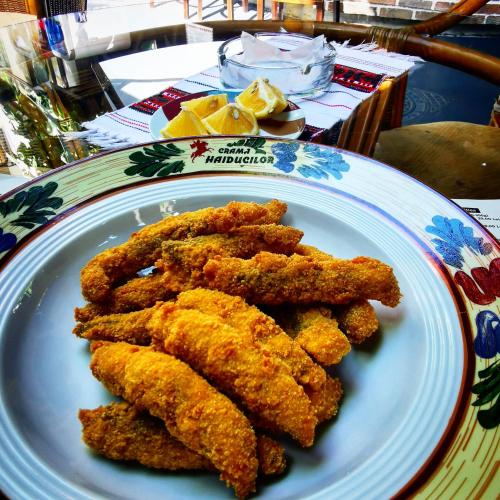 a plate of fried food on a table at Crama Haiducilor in Cluj-Napoca