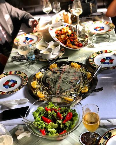 a table with a large turkey and vegetables on it at Crama Haiducilor in Cluj-Napoca