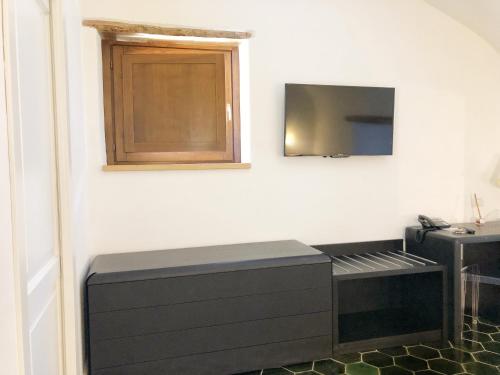 TV o dispositivi per l'intrattenimento presso Tenuta Duca Marigliano Boutique Hotel