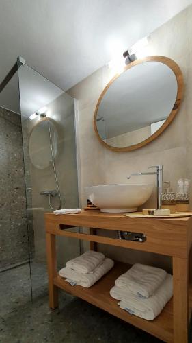 a bathroom with a sink and a mirror at Alexandra's Boutique House in Triovasálos